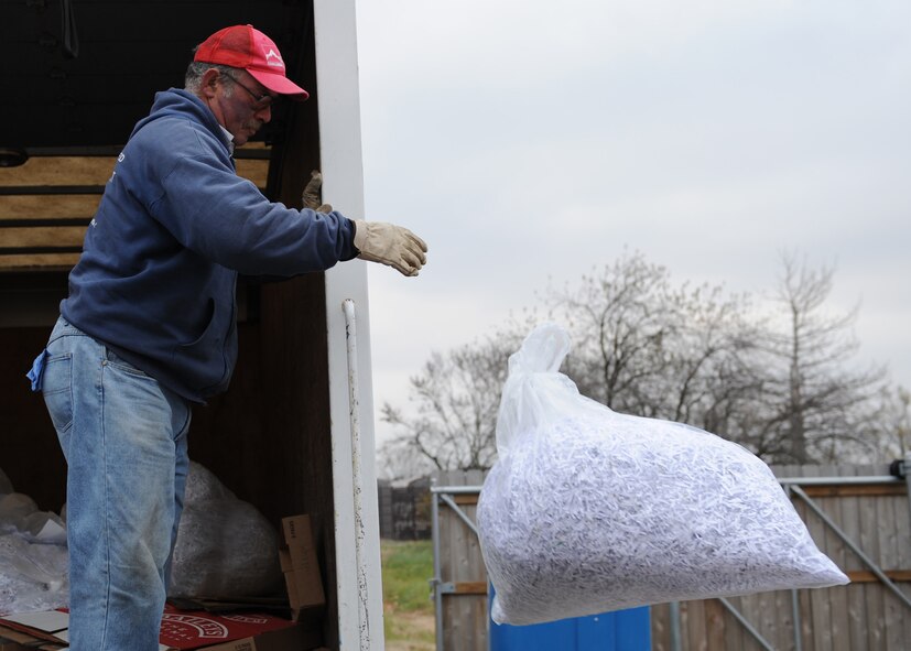 John Bircher, Scott Recycling Center Challenge Unlimited refuse worker, separates trash collected from recycling bins around Scott. 
(U.S. Air Force photo/Airman 1st Class Wesley Farnsworth)