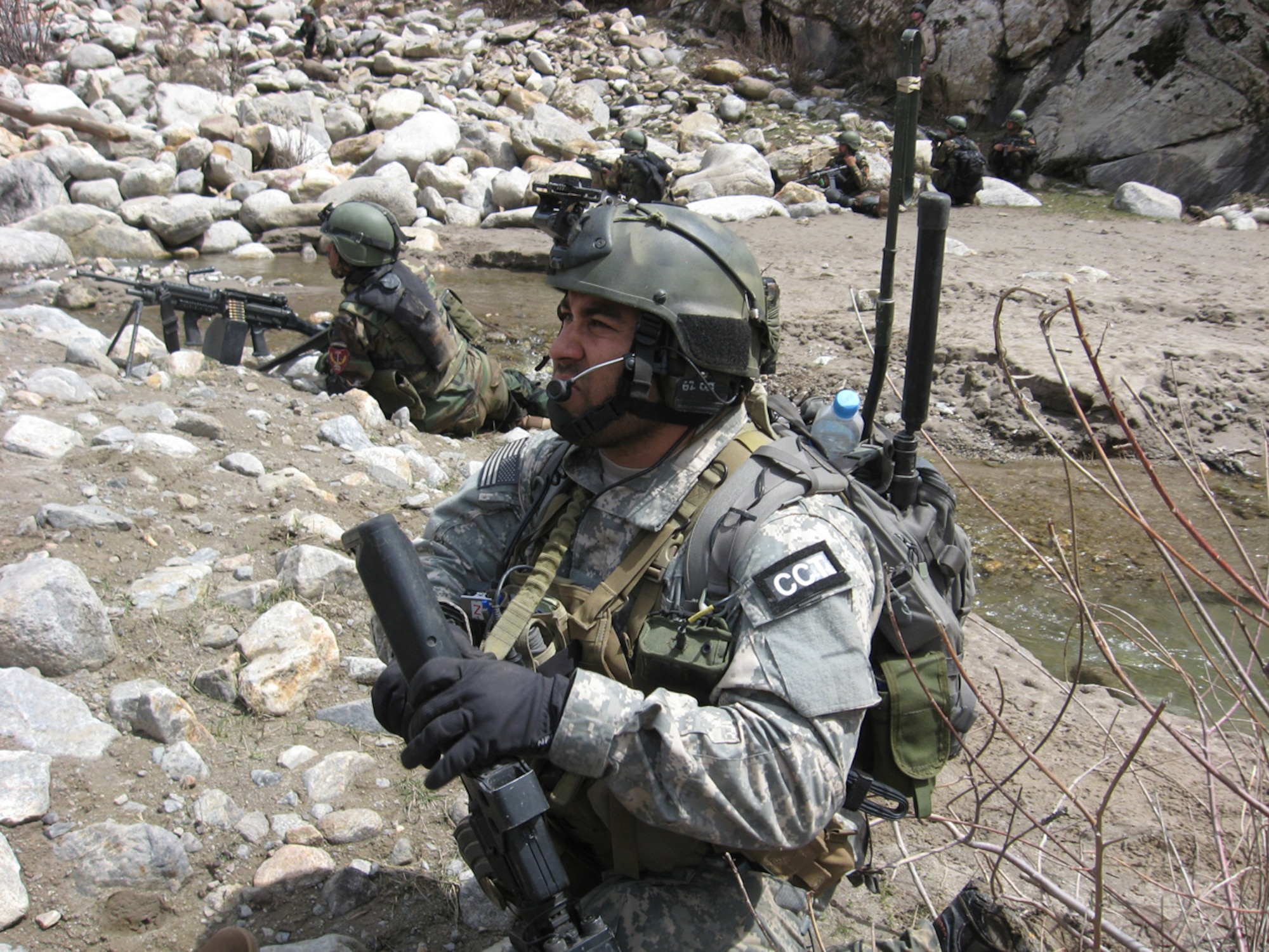 Staff Sgt. Robert Gutierrez Jr.(foreground) keeps a watchfull eye out for insurgeants or threats to his operational detachment team during one of many patrols he took part in while deployed in support of Operation Enduring Freedom.  (U.S. Air Force photo)