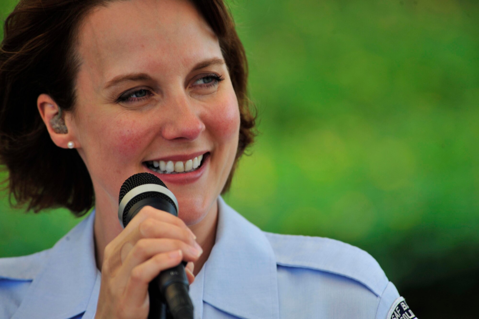 The United States Air Force Central Command Expeditionary Band visited Nairobi, Kenya for the first time November and played in different venues throughout the area.  Tech. Sgt. Paula Goetz, one of the band's vocalists sings for a crowd at the U.S. embassy in Kenya.  They also played for the U.S. ambassador and invited guests at his residence house, other performances included civic centers  and universities with crowds exceeding 1,800 people  .(U.S. Navy Photo/Petty Officer 1st Class Scott Cohen)(Released)
