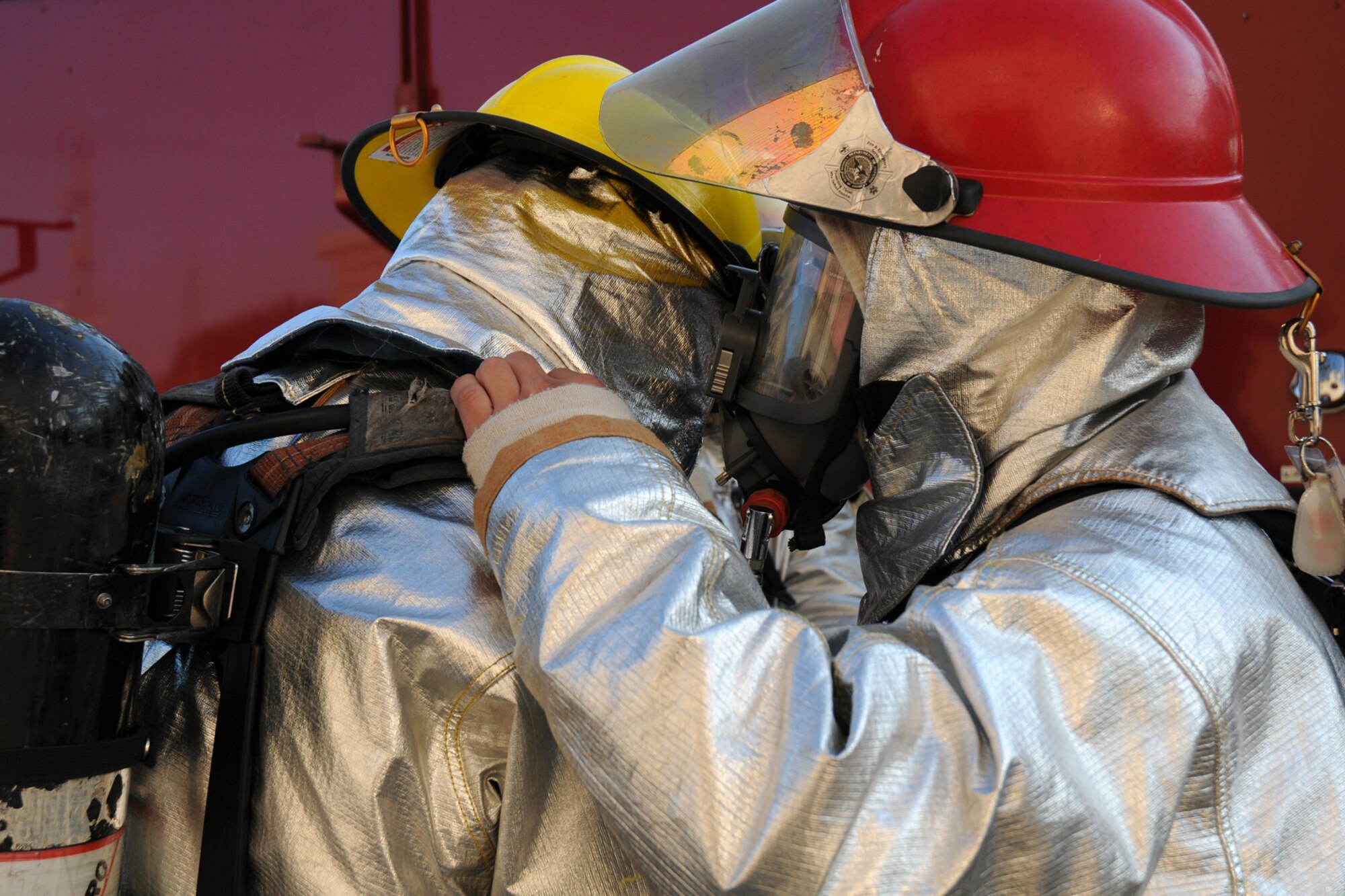Airman 1st Class Vincent Kinard (left) and Staff Sgt. John Garcia, 18th Civil Engineering Squadron, perform buddy checks after donning their chemical gear in preparation for a simulated kitchen fire at the Silver Flag Training Facility Dec. 2 at Kadena Air Base. The 18th Wing is practicing a Local Operational Readiness Exercise to test the readiness of Kadena Airmen.  (U.S. Air Force photo/Airman 1st Class Amanda Grabiec)