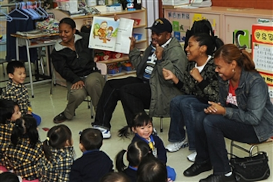 U.S. Navy chief petty officers assigned to the USS Blue Ridge, docked in Hong Kong, read to nursery school students at the Hong Kong Society for the  Protection of Children as part of a community outreach program. The USS Blue Ridge is the flagship for the commander, U.S. 7th Fleet. 