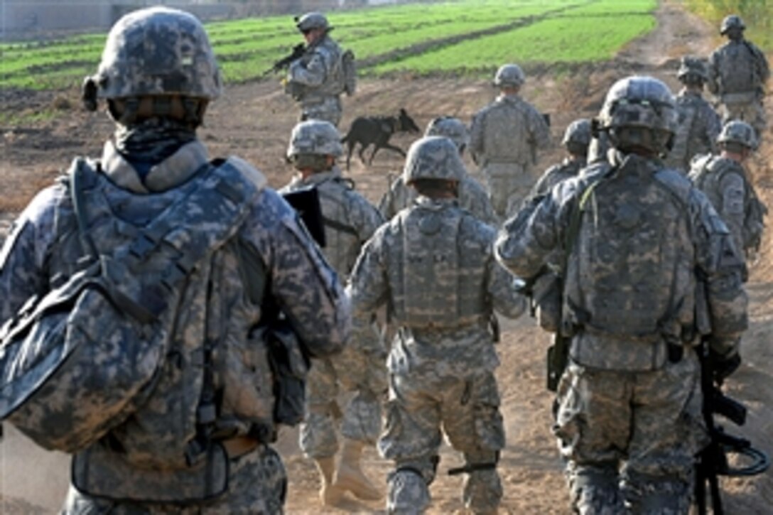 U.S. Army soldiers look for weapons and caches in Smahill, Iraq, Nov. 28, 2008. The soldiers are assigned to the 1st Armored Division's 4th Battalion, 27th Field Artillery Regiment, 2nd Brigade Combat Team.