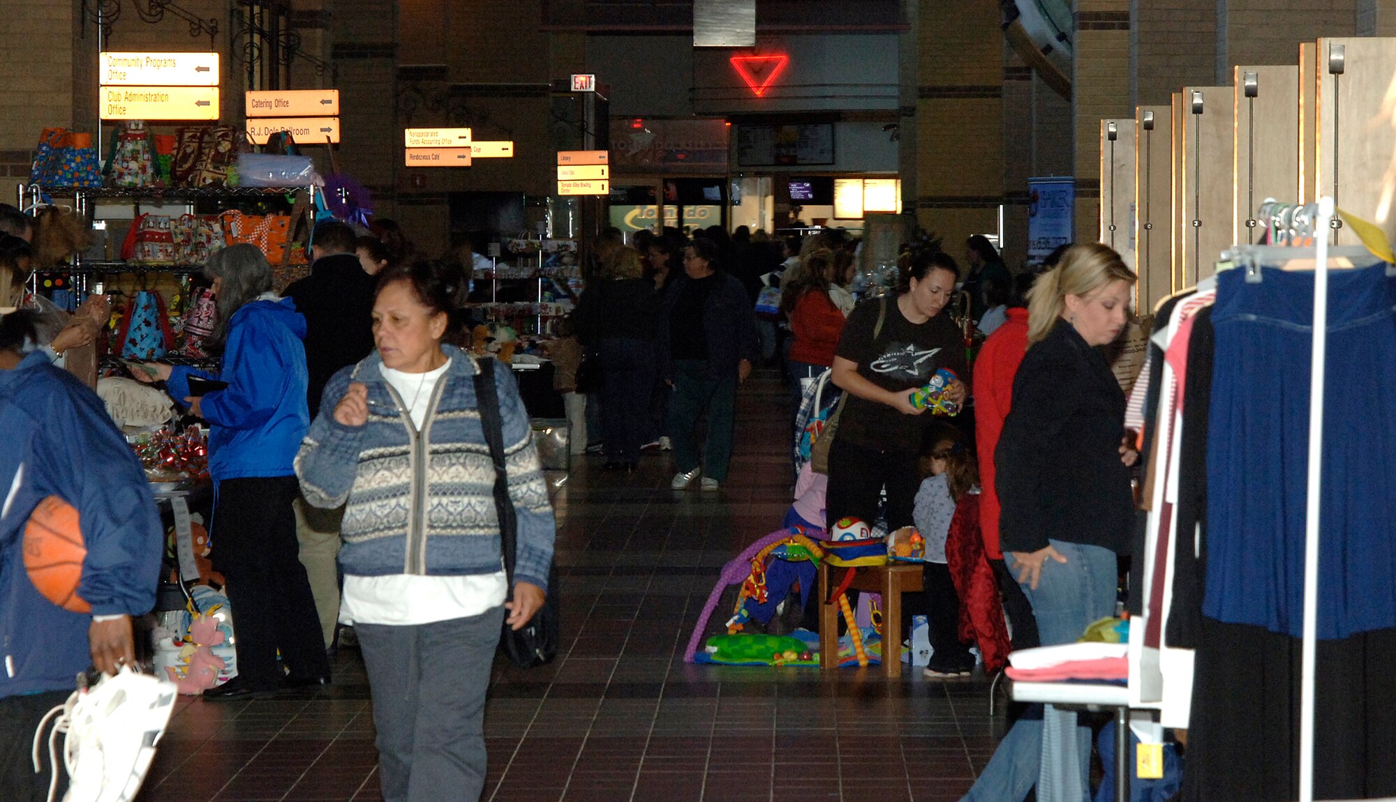 MCCONNELL AIR FORCE BASE, Kan. -- Team McConnell members shop and search for deals at the crafts fair and flea market held at the Robert J. Dole Community Center, Nov. 22.  The fair provided an opportunity for Team McConnell members to look for early holiday specials.   (Photo by Staff Sgt. Ronald Lafosse)
