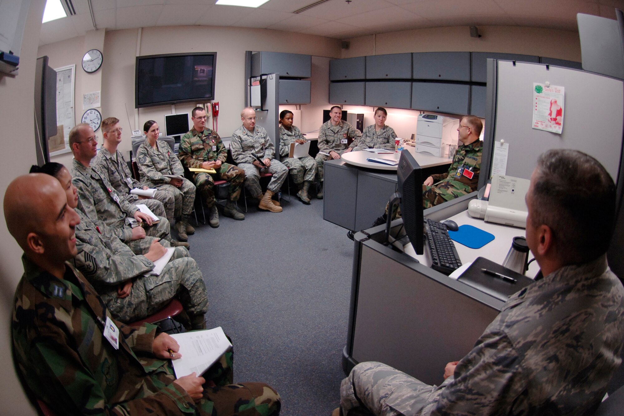 MCCONNELL AIR FORCE BASE, Kan. -- Col. John Korlaske, a health services inspection team member from Lackland Air Force Base, Texas, speaks to Team McConnell medical staff members about the importance of being mission ready for major catastrophes and deployments, Nov. 19 at McConnell. The HSI team partnered with the American Association for Ambulatory Health Care, a civilian based inspection team, to review McConnell’s medical facility and its staff Nov. 17 to 21. (Photo by Airman 1st Class Maria Ruiz)