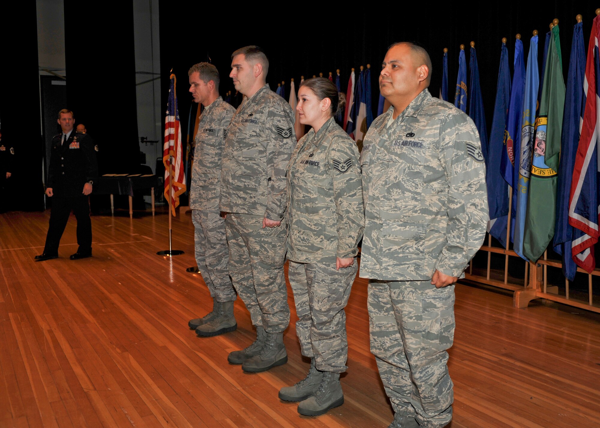 Arctic Warriors stand on stage during the Team Elmendorf Recognition Ceremony Dec. 1. These individuals were awarded a Stripe for Exceptional Performers during the ceremony. 

To master sergeant: 
Brian Dales, 3rd Medical Operations Squadron

To technical sergeant: 
Aaron Gagne, 3rd Aircraft Maintenance Squadron
Rayna Varela, 3rd Operations Support Squadron
Andres Gonzalez, 3rd Component Maintenance Squadron 

The STEP program, established in 1980, is designed to meet those unique circumstances that, in the commander’s judgment, clearly warrant promotion. Under STEP a limited number of Airmen with exceptional potential may be immediately promoted to the ranks of staff sergeant through master sergeant.

(U.S. Air Force photo/Senior Airman Tinese Treadwell)