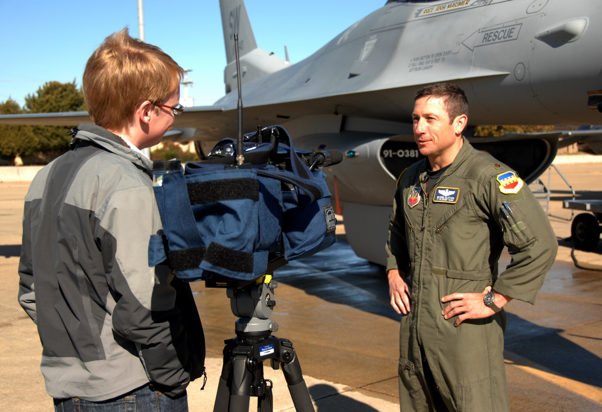 SHAW AIR FORCE BASE, S.C. -- Major George Clifford, commander and pilot for Viper East demo team is interviewed by a reporter from WIS-Columbia. "Until March I'll fly regularly with the fighter squadrons," said Major Clifford. "Demo flying is a completely different mind-set from tactical flying." (U.S. Air Force photo/Staff Sgt. Holly Brown)