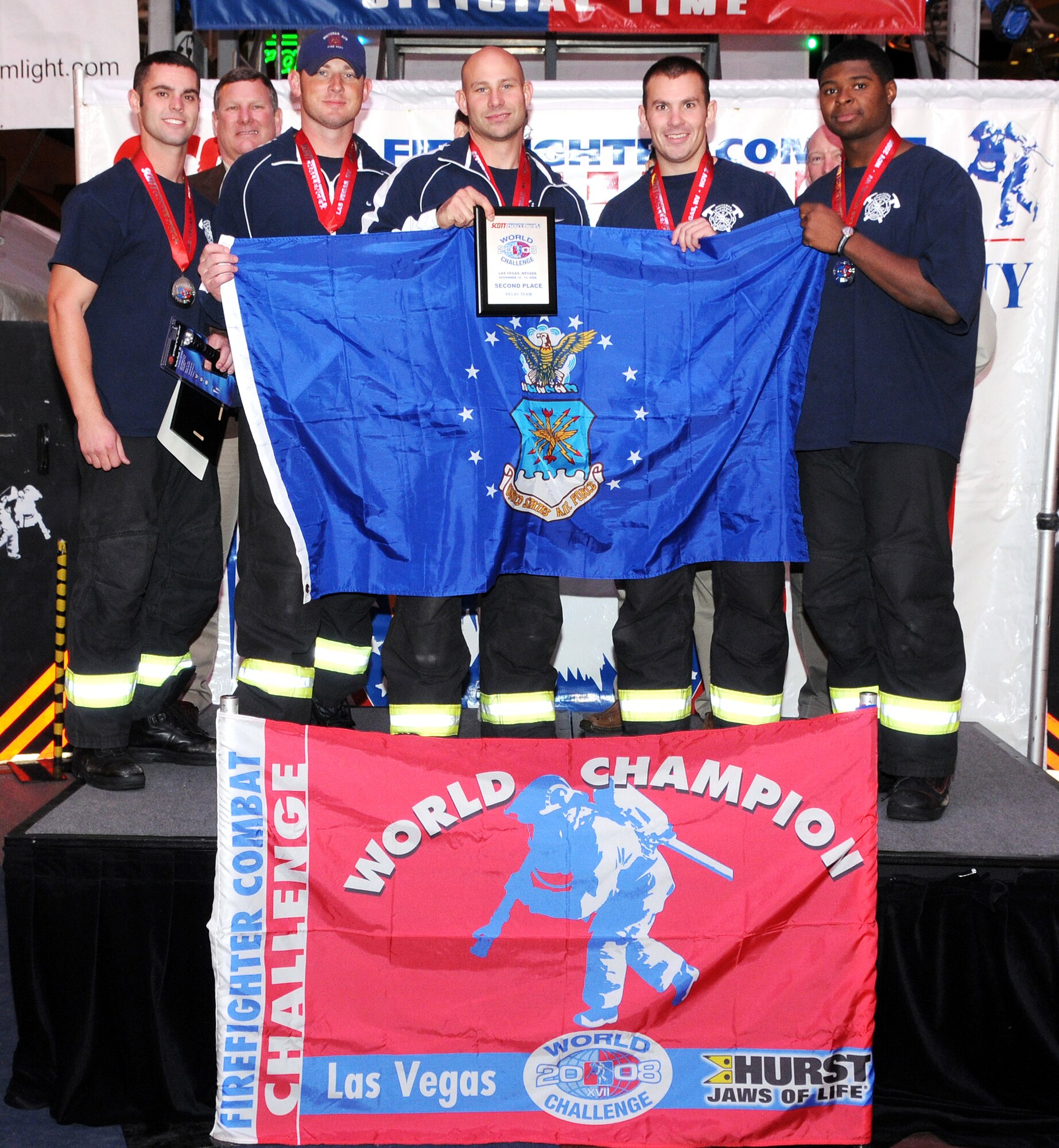 LAS VEGAS, Nev. - Airman 1st Class Blake Johnson, Chris Finkes, Staff Sgt. Cory McGee and Senior Airman Rick Wiese and Derrick Allen, all from the 509th Civil Engineer Squadron, pose for  a photo after placing second at the2008 Scott World Firefighter Combat Challenge in Las Vegas Nov. 16. Thousands of spectators watched as the team competed in the challenge, which attracts hundreds of U.S. and Canadian municipal fire departments. (Photo printed with permission of Rick Wiese)