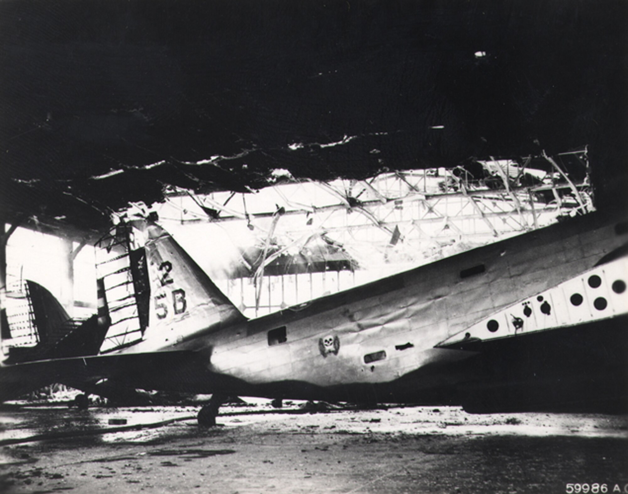 HICKAM AIR FORCE BASE, Hawaii -- 5th Bomb Group B-18A Bolo’s sit destroyed in their hangar at Hickam Field, Oahu, after the Imperial Japanese Navy struck Oahu's military installations and plunged the United States into World War II on Dec. 7, 1941. (U.S. Army Signal Corps photo)