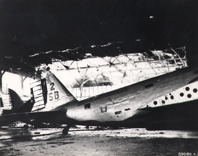 HICKAM AIR FORCE BASE, Hawaii -- 5th Bomb Group B-18A Bolo’s sit destroyed in their hangar at Hickam Field, Oahu, after the Imperial Japanese Navy struck Oahu's military installations and plunged the United States into World War II on Dec. 7, 1941. (U.S. Army Signal Corps photo)