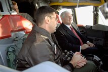 MINOT AIR FORCE BASE, N.D. -- Lt. Col. Shannon Kruse, 23rd Bomb Squadron commander, shows Secretary of Defense Robert M. Gates controls in the cockpit of a B-52H Stratofortress static display during his visit here Dec. 1. Secretary Gates' visit to Minot AFB was a first for the secretary of defense. (U.S. Air Force photo by Airman 1st Class Benjamin Stratton)