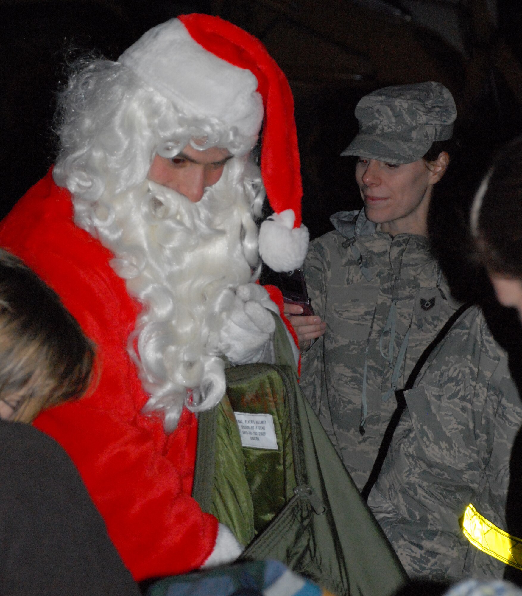 Santa Claus hands out treats during the annual Christmas tree lighting ceremony Dec. 2.  (U.S. Air Force photo/Staff Sgt. Chad Padgett)
