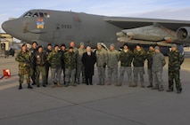 MINOT AIR FORCE BASE, N.D. -- Secretary of Defense Robert M. Gates poses with Airmen from Minot AFB in front of a B-52H Stratofortress Bomber, here 1 Dec. Secretary Gates made history as the first secretary of defense to visit Minot Air Force Base.  (U.S. Air Force photo by Senior Airman Joe Rivera)