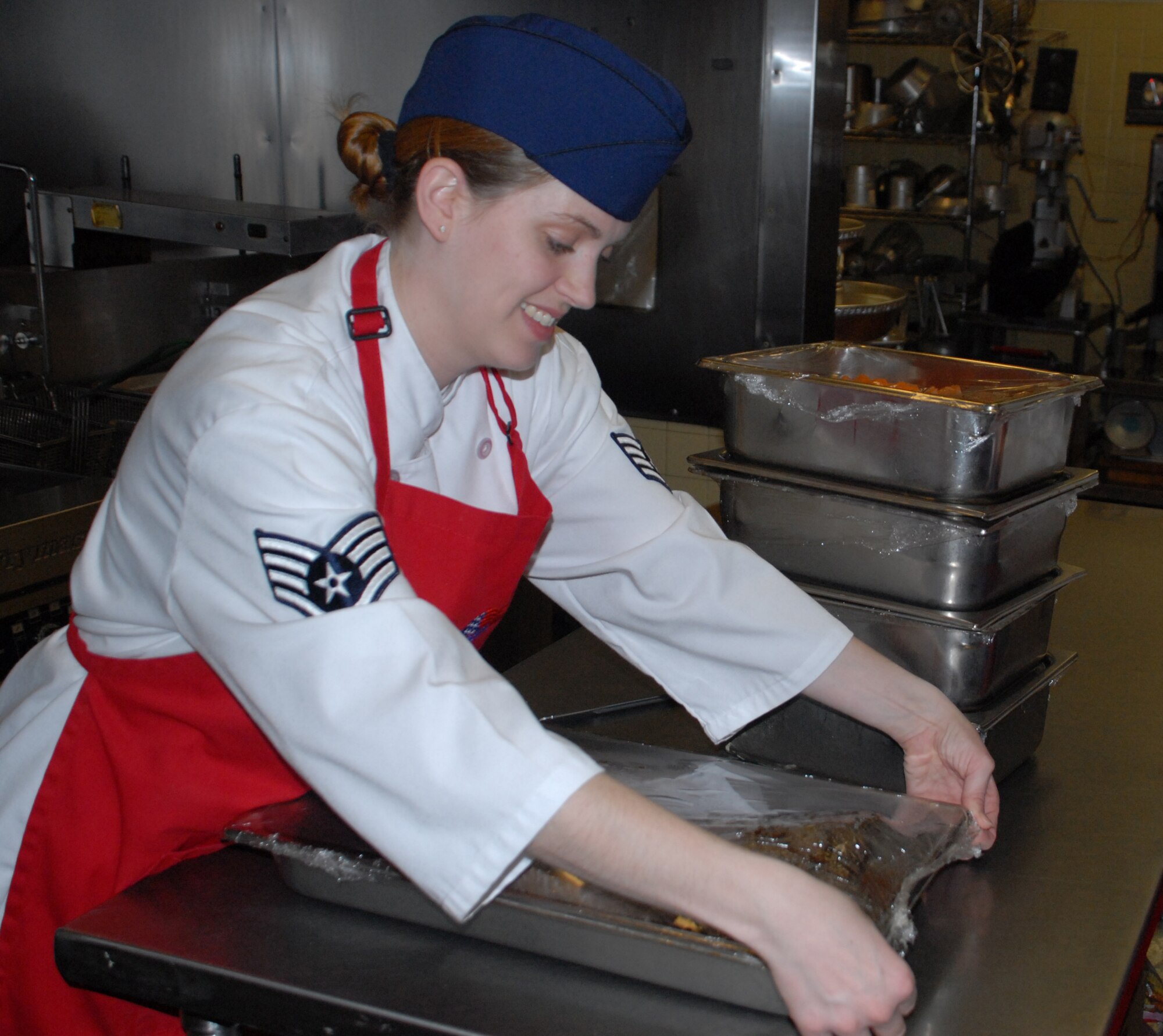 Staff Sgt. Tammy Novak, 436th Services Squadron food service accountant, prepares food for the Thanksgiving feast at the Patterson Dining Facility Nov. 28.  (U.S. Air Force photo/Staff Sgt. Chad Padgett)