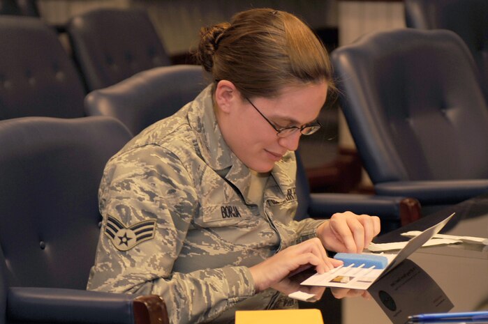 Senior Airman Ashley Borja, 99th Comptroller Squadron special actions technician, completes a swab test in a bone marrow registration drive on Nellis Air Force Base, Nev., December 2, 2008. From Dec. 1-12, Team Nellis is holding the 2008 DoD Bone Marrow Program Registration Drive, registering eligible military identification card holders, including active-duty service members and their spouses, civil service, guard, reserve and Coast Guard.