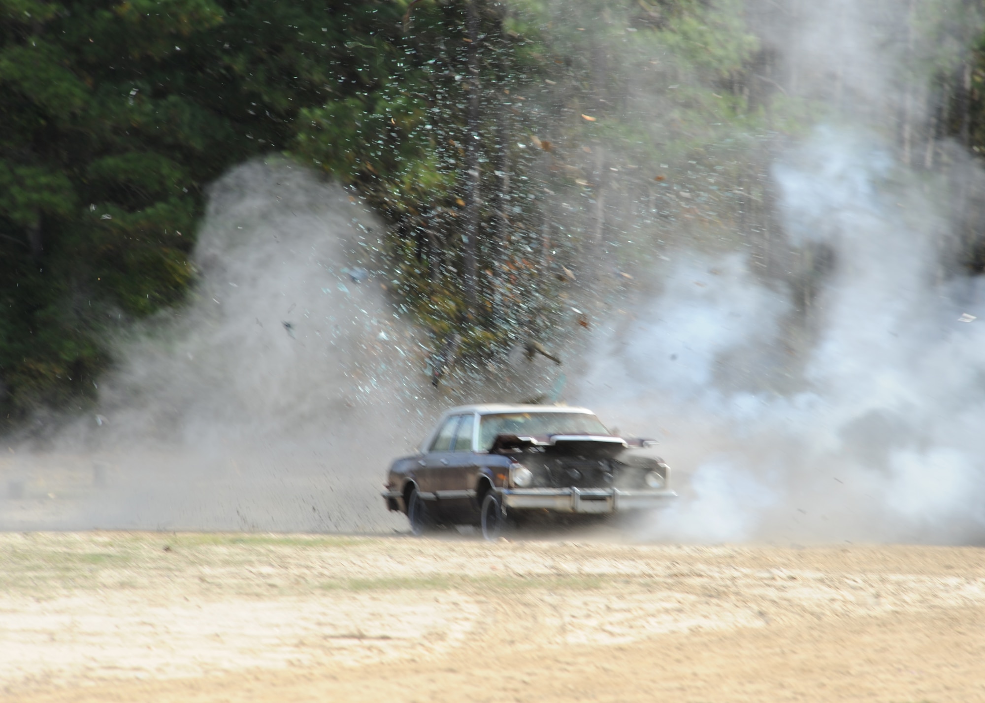 The Explosive Ordnance Disposal team blows up a vehicle  with a boot banger bomb on Seymour Johnson Air Force Base, N.C. Nov. 18, 2008. EOD is responsible for the identification, security, and disposal of hazardous unexploded conventional and chemical munitions and improvised explosive devices while at home and during deployment. (U.S. Air Force photo by Airman 1st Class Whitney Stanfield)
