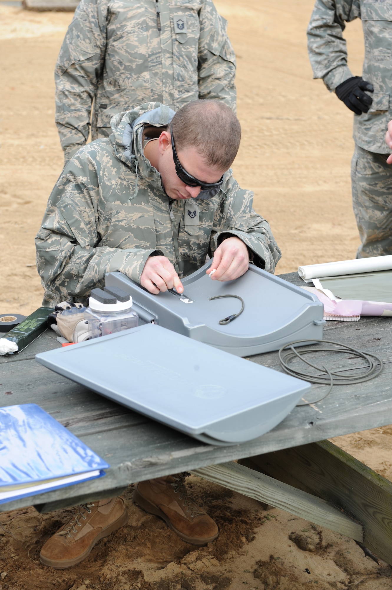 Staff Sergeant Dustin Epperson begins to make a practice bomb by holding down the wire with C4 on top here at Seymour Johnson Air Force Base, N.C. Nov. 18, 2008. EOD is responsible for the identification, security, and disposal of hazardous unexploded conventional and chemical munitions and improvised explosive devices while at home and during deployment. (U.S. Air Force photo by Airman 1st Class Whitney Stanfield)