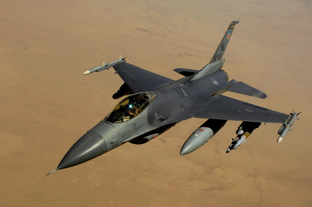 An F-16 Fighting Falcon aircraft returns to the fight after receiving fuel from a KC-135 Stratotanker during a mission over Iraq. The F-16, with its high maneuverability, provides top cover for coalition forces in support of Operation Iraqi Freedom. (U.S. Air Force photo/Master Sgt. Andy Dunaway) 
