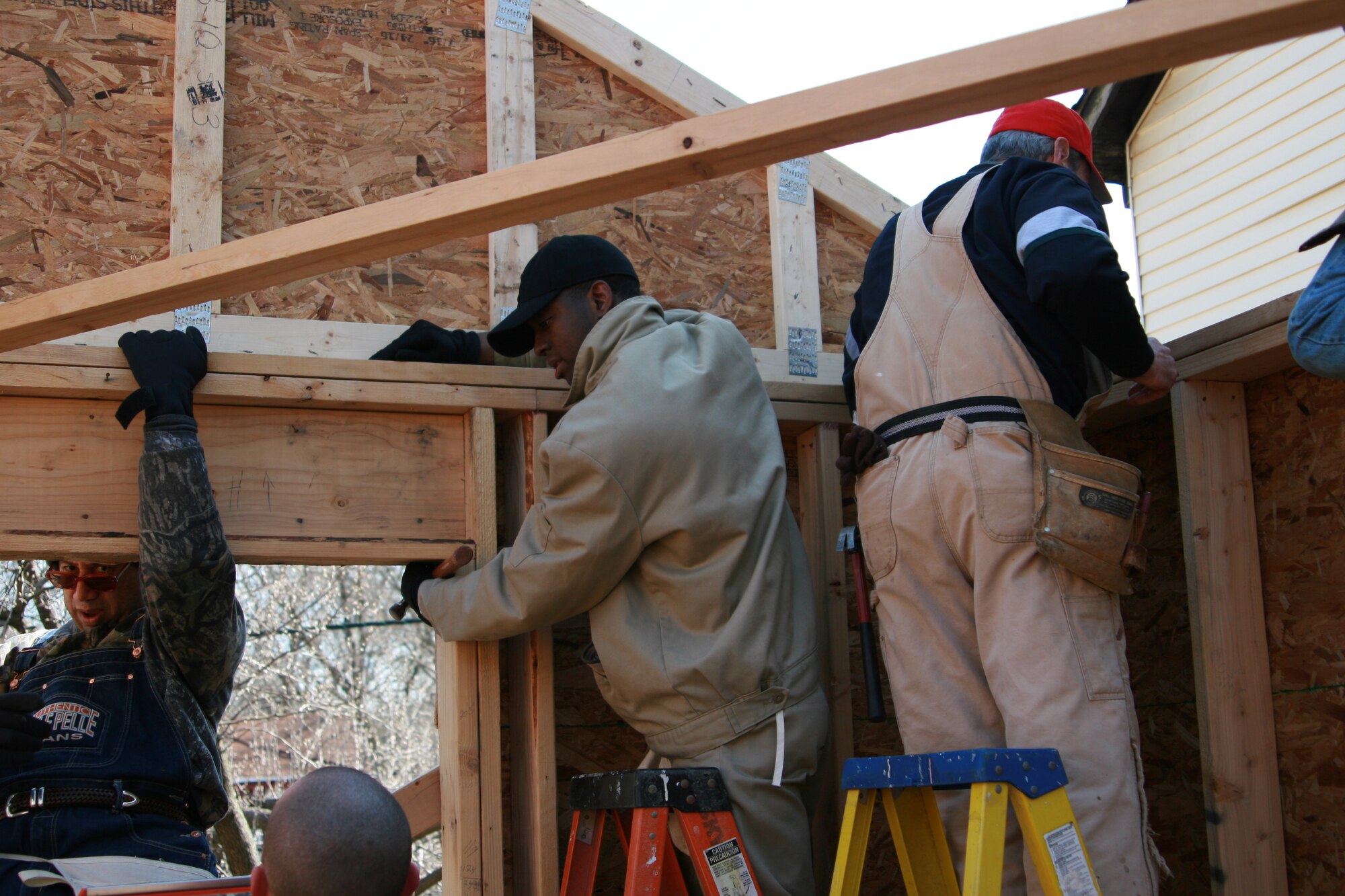 Members from the 305th Communications Squadron put up trusses on a house while volunteering with Habitat for Humanity. The 305th CS members have helped complete two homes in Beverly, N.J., and are currently working on two more. (U.S. Air Force courtesy photo)