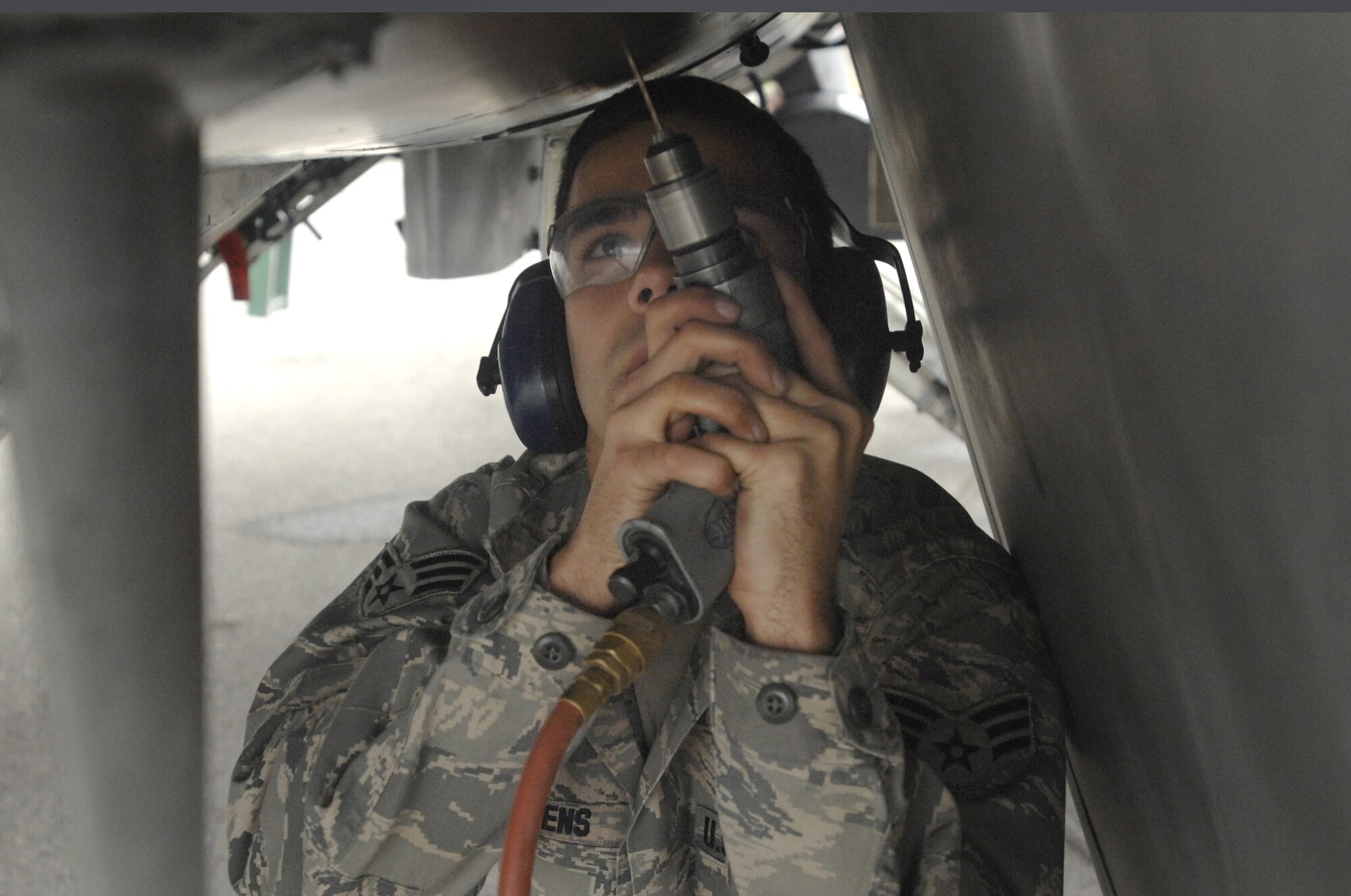 Senior Airman Shane Stevens, 31st Maintenance Squadron, removes a panel from an F-16 Fighting Falcon during the 2008 Nickel Javelin exercise Nov. 6, 2008. Nickel Javelin is a 26-day bilateral training exercise between the U.S. and Bulgarian Air Forces which took place at Graf Ignatievo Air Base, Bulgaria. Approximately 250 Airmen from Aviano Air Base participated in the exercise.  (U.S. Air Force photo/Airman 1st Class Ashley Wood)