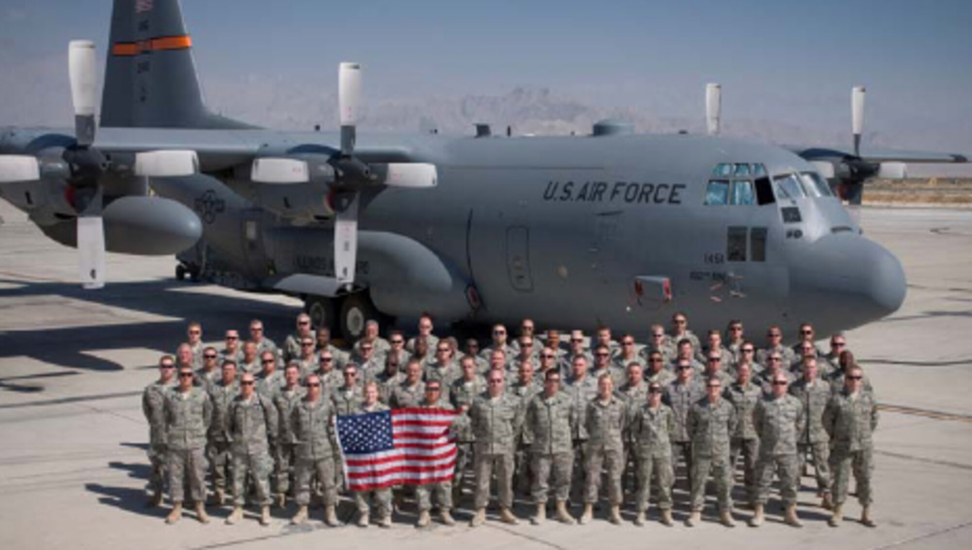 Members from the 182nd Airlift Wing pose in front of one of Peoria’s C-130s as the first Air Expeditionary Force rotation currently in Afghanistan. (Courtesy Photo)