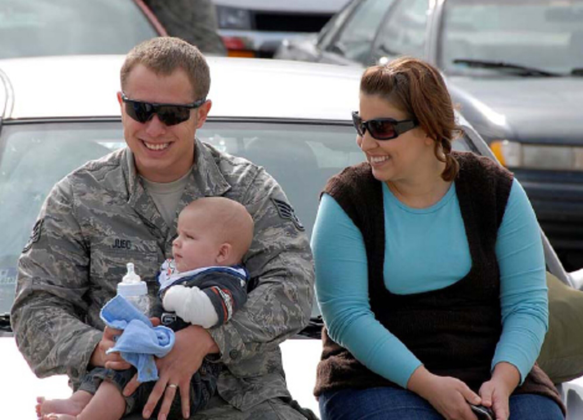 Staff Sgt. Bradley Judd of the 182nd Maintenance Squadron is joined by his wife Nichole and his five-month old son Payton shortly after arriving back in Peoria Oct. 14. The returning group of aircrew, maintainers, and other support personnel had departed for the 182nd Airlift Wing’s first rotation of the Air Expeditionary Force (AEF #1) August 23. Photo by Tech. Sgt. Todd A. Pendleton