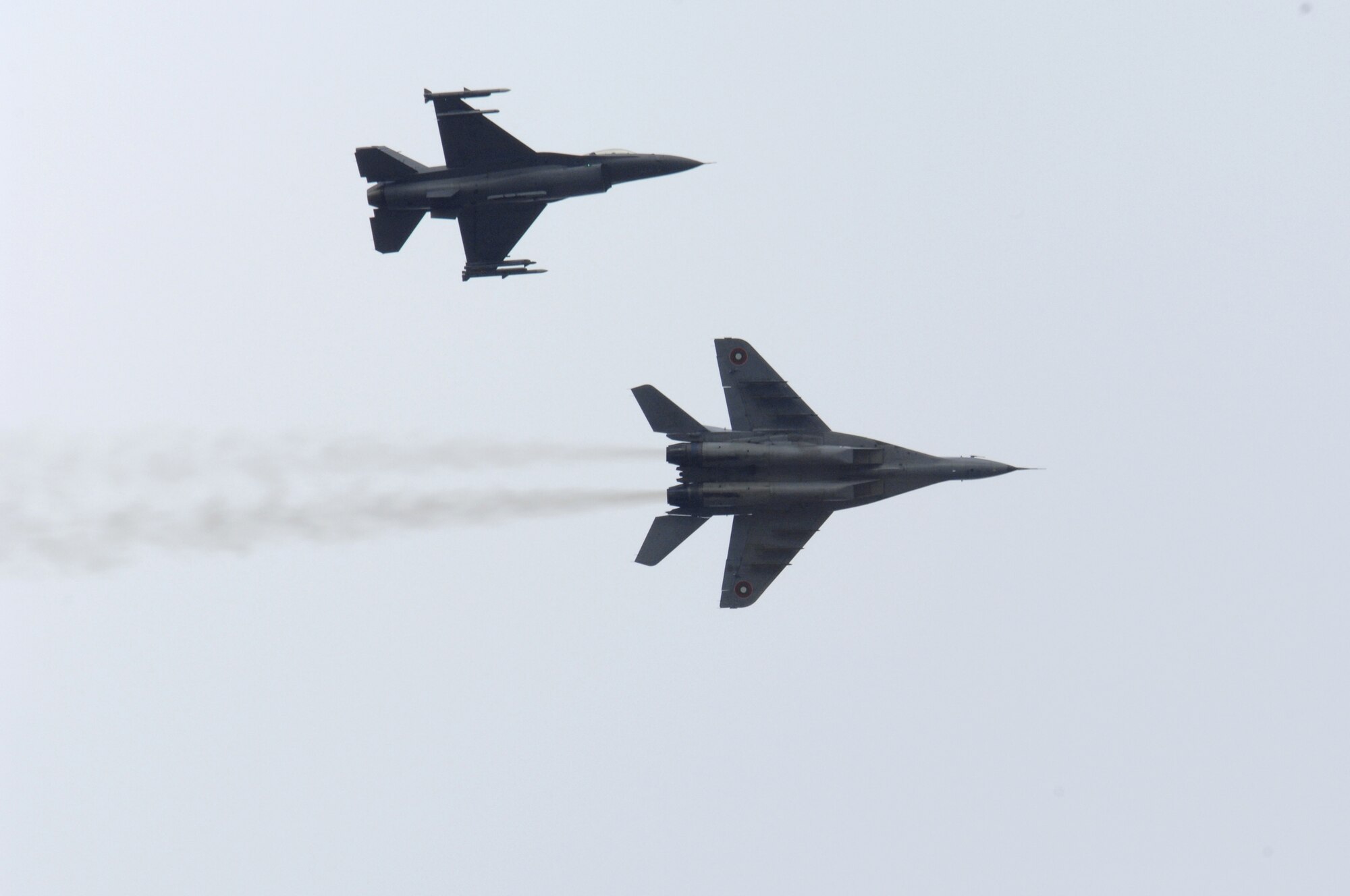 An F-16 Fighting Falcon and a Mig-29 fly side by side during exercise Nickel Javelin Nov. 10, 2008.  Nickel Javelin is a 26-day bilateral training exercise between the U.S. and Bulgarian Air Forces.  (U.S. Air Force photo/Airman 1st Class Ashley Wood)