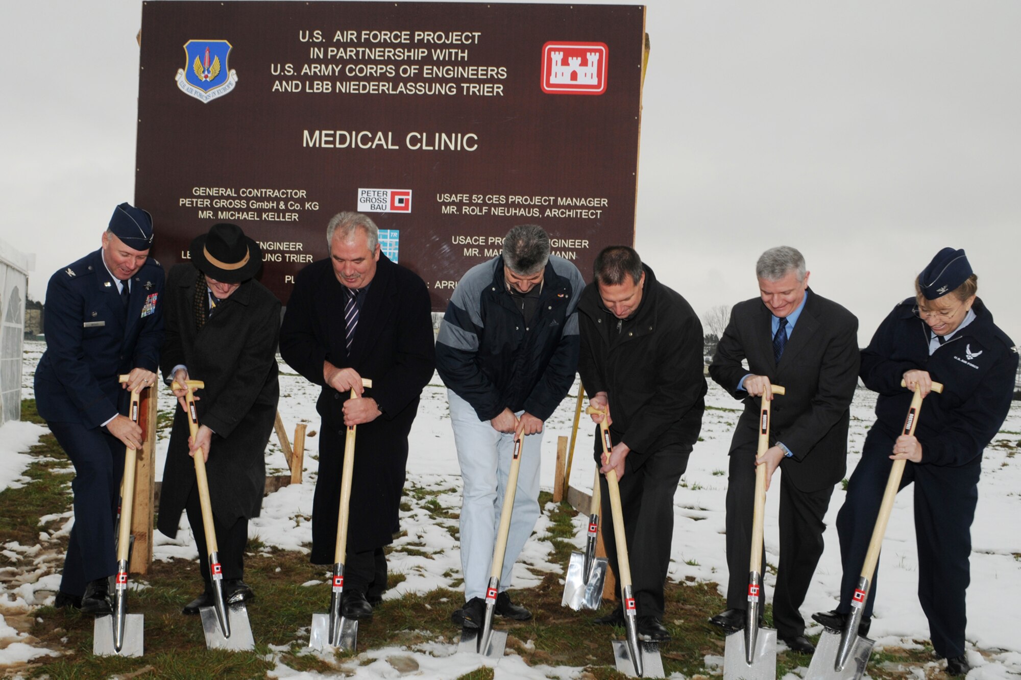 Col. Tip Wight, 52nd Fighter Wing commander, Dr. Christoph Tein, LBB Trier, Herr Michael Billen, State Parliamentarian, Herr Klaus Rodens, Mayor of Spangdahlem, Herr Bernd Oberlander, Firm Gross, Mr. Kris Hurst, U.S. Army Corps of Engineers, and Col. Lorrie Cappellino, 52nd Medical Group commander break ground to begin construction for the Spangdahlem Clinic, Nov. 24, 2008  The clinic is being built to consolidate medical care for the Spangdahlem community and is expected to open in 2011.  (U.S. Air Force photo by Staff Sgt. Logan Tuttle.)