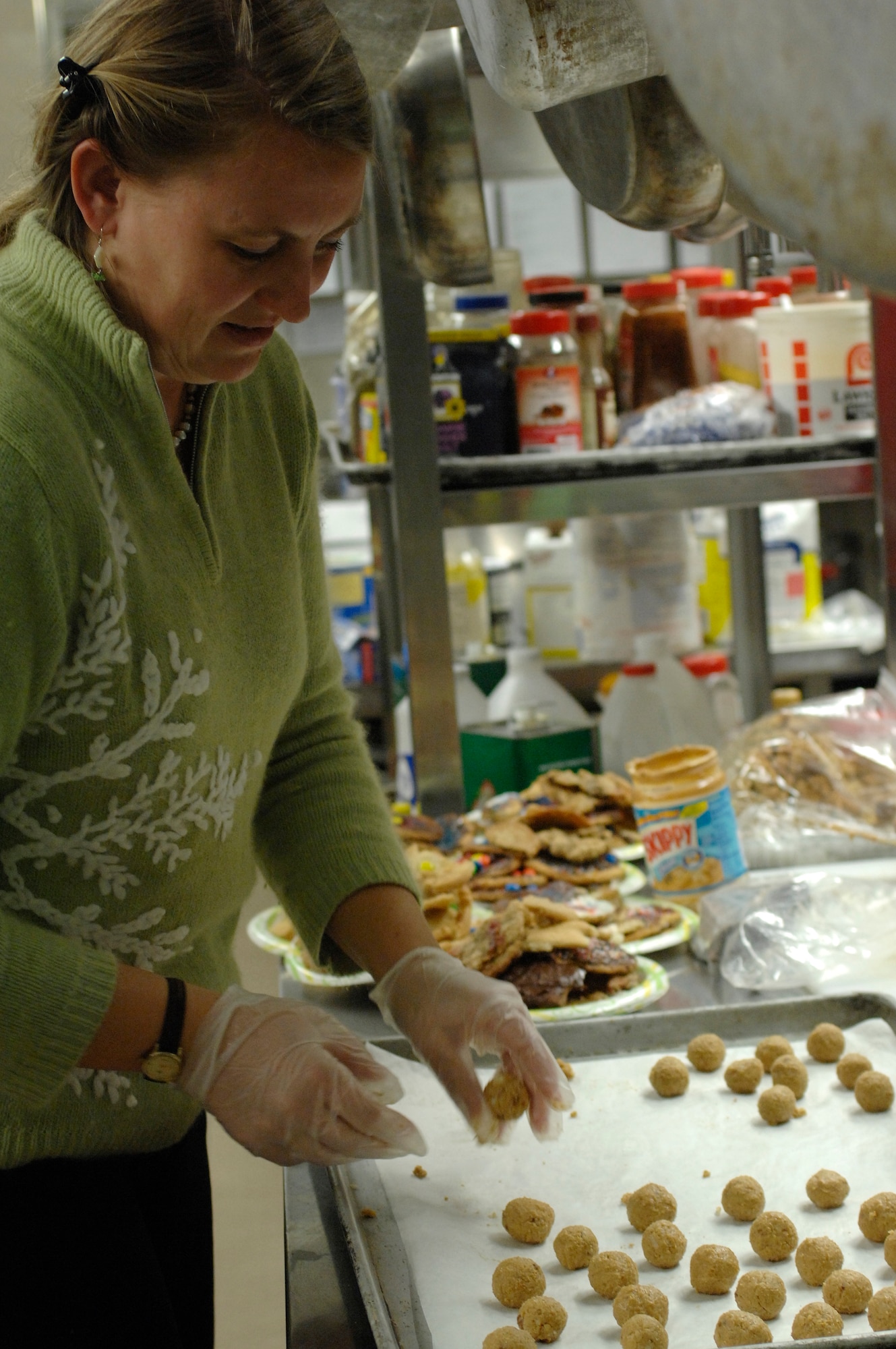 Shawn Stevens prepares cookies to be baked at the La Bella Vista Club Dec. 2 during the 2008 annual Airman Cookie Drive. More than 9,000 cookies were baked to bring a little taste of home to single Airmen living in the dormitories here.   (U.S. Air Force photo/Airman 1st Class Ashley Wood)