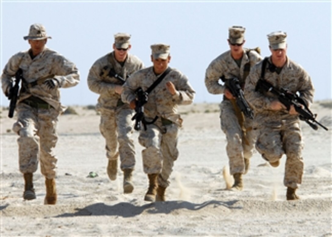U.S. Marine Corps Lance Cpls. Crecencio Alvarez (left), Jordan Soderman, Mario Launder and Andrew Stueber and Cpl. Christopher Burgess, all from 4th Platoon's fleet antiterrorism security team, advance to their next point during bilateral urban assault training in the Middle East on Nov. 20, 2008.  The Marines are deployed to the U.S. 5th fleet area of responsibility supporting maritime security operations.  