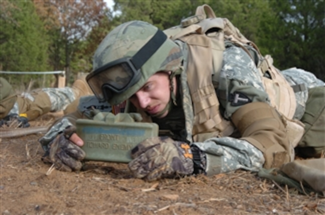 A U.S Army soldier, from the 636th Military Intelligence Battalion, Texas Army National Guard, sets up a Claymore anti-personnel mine during pre-deployment training at Camp Swift, Texas, on Nov. 13, 2008.  The 636th is scheduled to deploy to Afghanistan in support of Operation Enduring Freedom.  