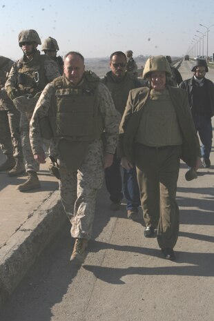 Major Gen. Martin Post, deputy commanding general for Multi-National Force-West, and Al-Kumanji Mawafek Mohammed, director of real estate, and several other members of the Iraqi government, arrive at the Haditha Dam to officially turnover the structure to the Iraqi government Dec 3. The Haditha Dam has served as a home for Coalition forces for the past five years.  ::r::::n::