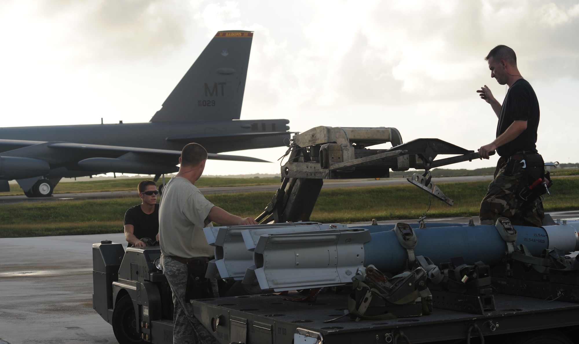 (back left) Senior Airman Daniel Katris operates a lift truck  while (center) Staff Sgt. Richard Timmerman and (top right) Tech. Sgt. Jamie Mikus guides an inert GBU-31 to be loaded onto a B-52 Stratofortress Nov. 26, at Andersen Air Force Base, Guam during the Aces North exercise.  Aces North is a two week mission employment phase of the Australians version of the U.S. Air Force Weapons School.   The exercise is scheduled to end Dec. 4. Personnel are all weapons loaders from the 23rd Expeditionary Bomb Squadron deployed from Minot Air Force Base, N.D. The bomber's participation in constant training helps emphasize the U.S. bomber presence, demonstrating U.S. commitment to the Pacific region.

(U.S. Air Force photo/ Master Sgt. Kevin J. Gruenwald) released






















  












 

























