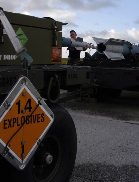 Tech. Sgt Jamie Mikus, 23rd Expeditionary Bomb Squadron weapons loader deployed from Minot Air Force Base, N.D., prepares an inert GBU-31 to be loaded onto a B-52 Stratofortress Nov. 26, at Andersen Air Force Base, Guam during the Aces North exercise. Aces North is a two week mission employment phase of the Australians version of the U.S. Air Force Weapons School.   The exercise is scheduled to end Dec. 4. The bomber's participation in constant training helps emphasize the U.S. bomber presence, demonstrating U.S. commitment to the Pacific region.


(U.S. Air Force photo/ AIC Ryan Whitney)  released


















  












 

























