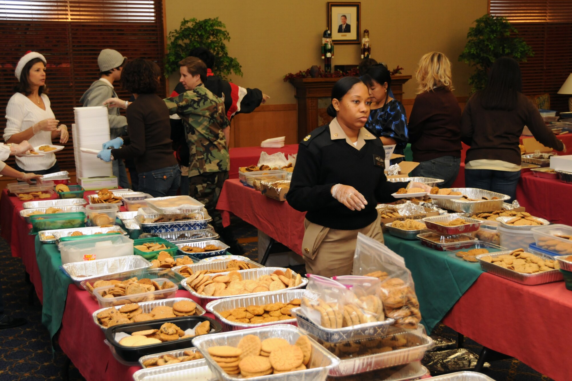 MISAWA AIR BASE, Japan -- Members of the Misawa community fill trays of cookies in support of the 35th Fighter Wing Cookie Caper Dec. 3, 2008. More than 40 people signed up to share their time but walk-in volunteers were also welcomed during the event. (U.S. Air Force photo by Senior Airman Jamal D. Sutter)