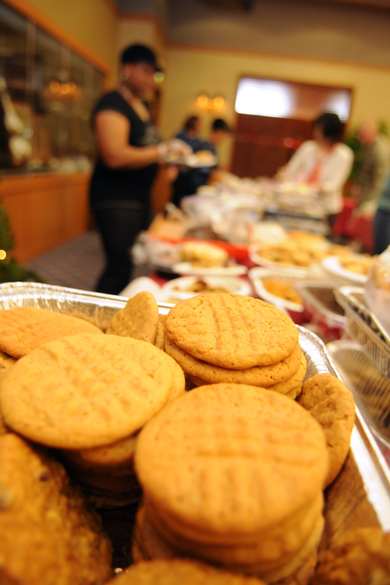 MISAWA AIR BASE, Japan -- Volunteers for the 35th Fighter Wing Cookie Caper collect cookies at the Officer's Club Dec. 3, 2008. The goal of the Cookie Caper is to help raise the morale of unaccompanied single Airman, Sailors and Soldiers on base. (U.S. Air Force photo by Senior Airman Jamal D. Sutter)