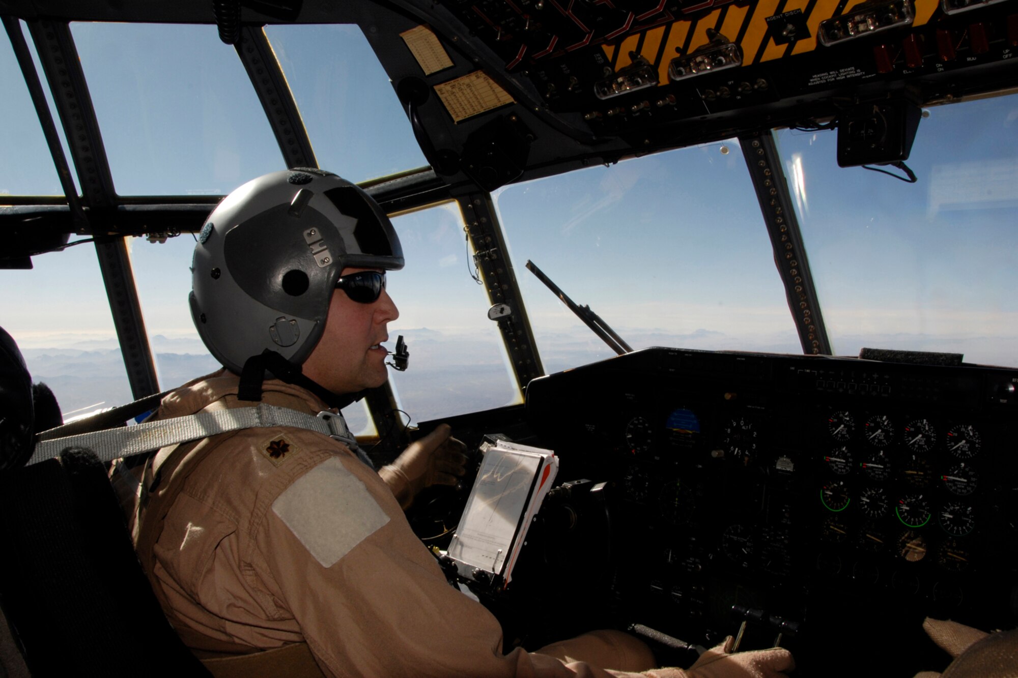 Command Pilot Maj. Jeff Wong, 109th Airlift Squadron, 133rd Airlift Wing, briefs air crew as they approach their first destination in Herat to transport top U.S. Army and Afghan military leaders to Kabul, Afghanistan on Monday, Dec. 1, 2008. 