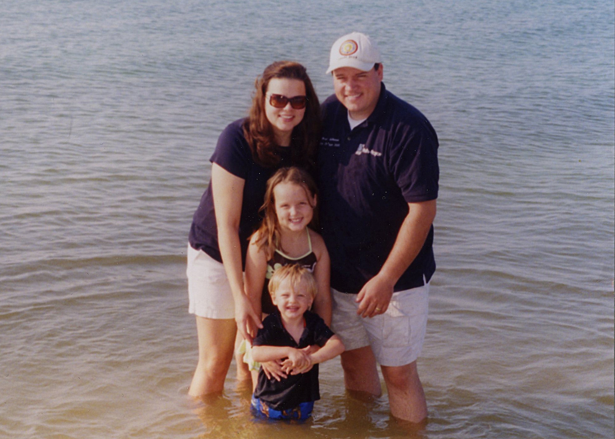 Jessica McNeese poses for a photo with her family, including husband, Brad, an ATA electrician, in Florida during Labor Day weekend in 2008. Mrs. McNeese is a nurse practioner for the contractor's clinic at Arnold's Medical Aid Station. (Photo provided)