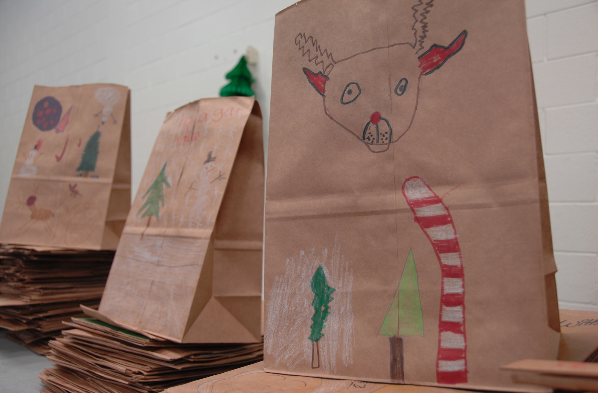 SHAW AIR FORCE BASE, S.C. -- "Children decorate brown paper bags donated by the Commissary," said Valerie Van der Veer, co-chair on the 2008 Annual Cookie Drive committee. "This is the event that touches the most lives because of the involvement of the local community - both those who give and those who receive." (U.S. Air Force photo/2nd Lt. Emily Chilson)