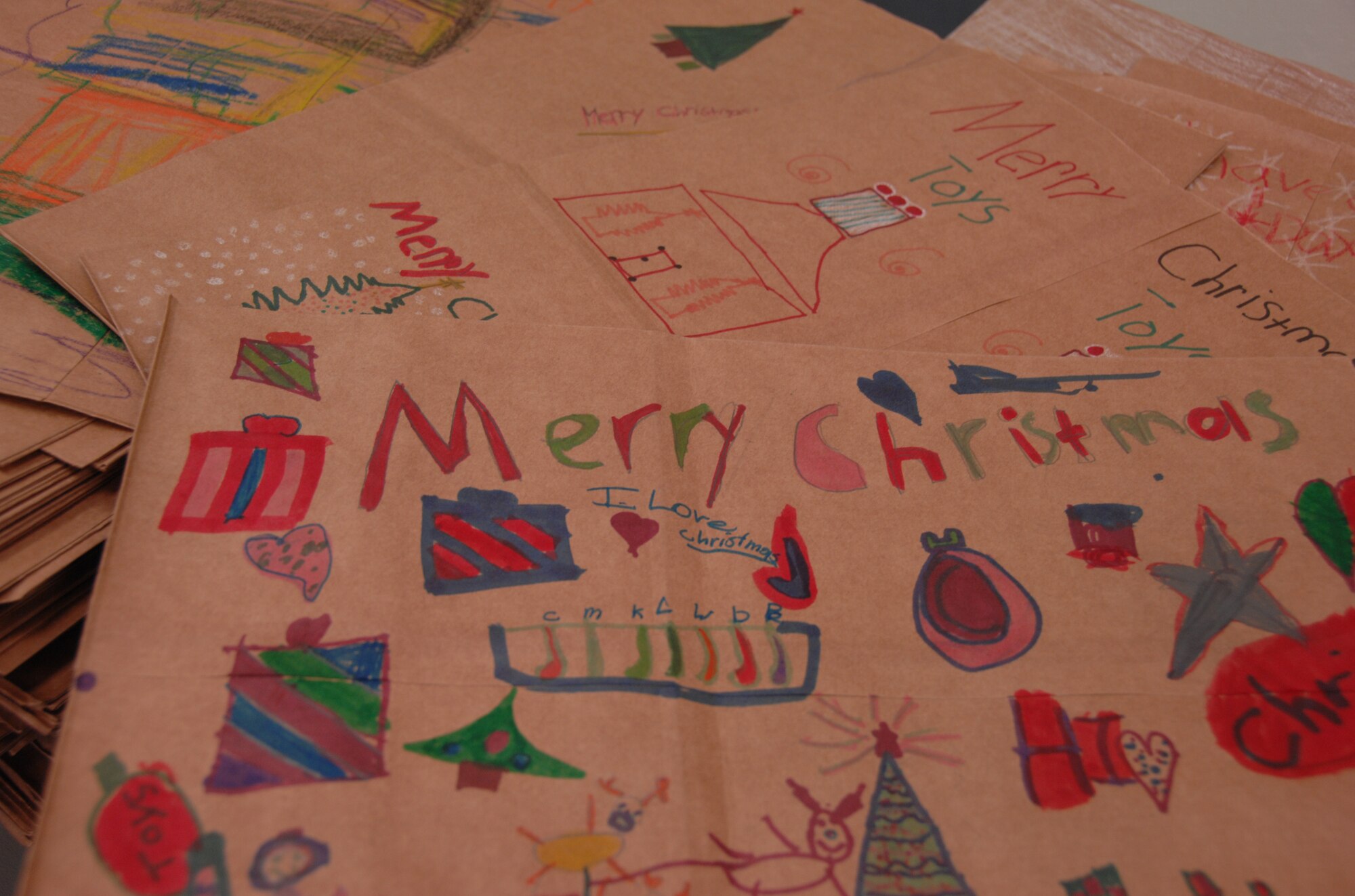 SHAW AIR FORCE BASE, S.C. -- Children from local schools and churches decorated more than 1,000 brown paper sacks donated by the Shaw AFB Commissary for the annual cookie drive. These bags will be filled with cookies and delivered to Airmen in the dorms here. (U.S. Air Force photo/2nd Lt. Emily Chilson)