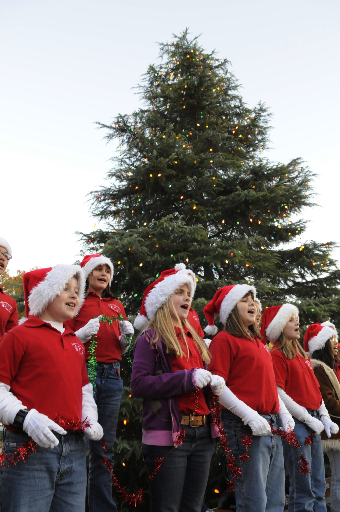 The Robins Elementary Chorus sang holiday songs at the Christmas tree lighting ceremony at Robins Chapel Dec. 3. U. S. Air Force photo by Sue Sapp