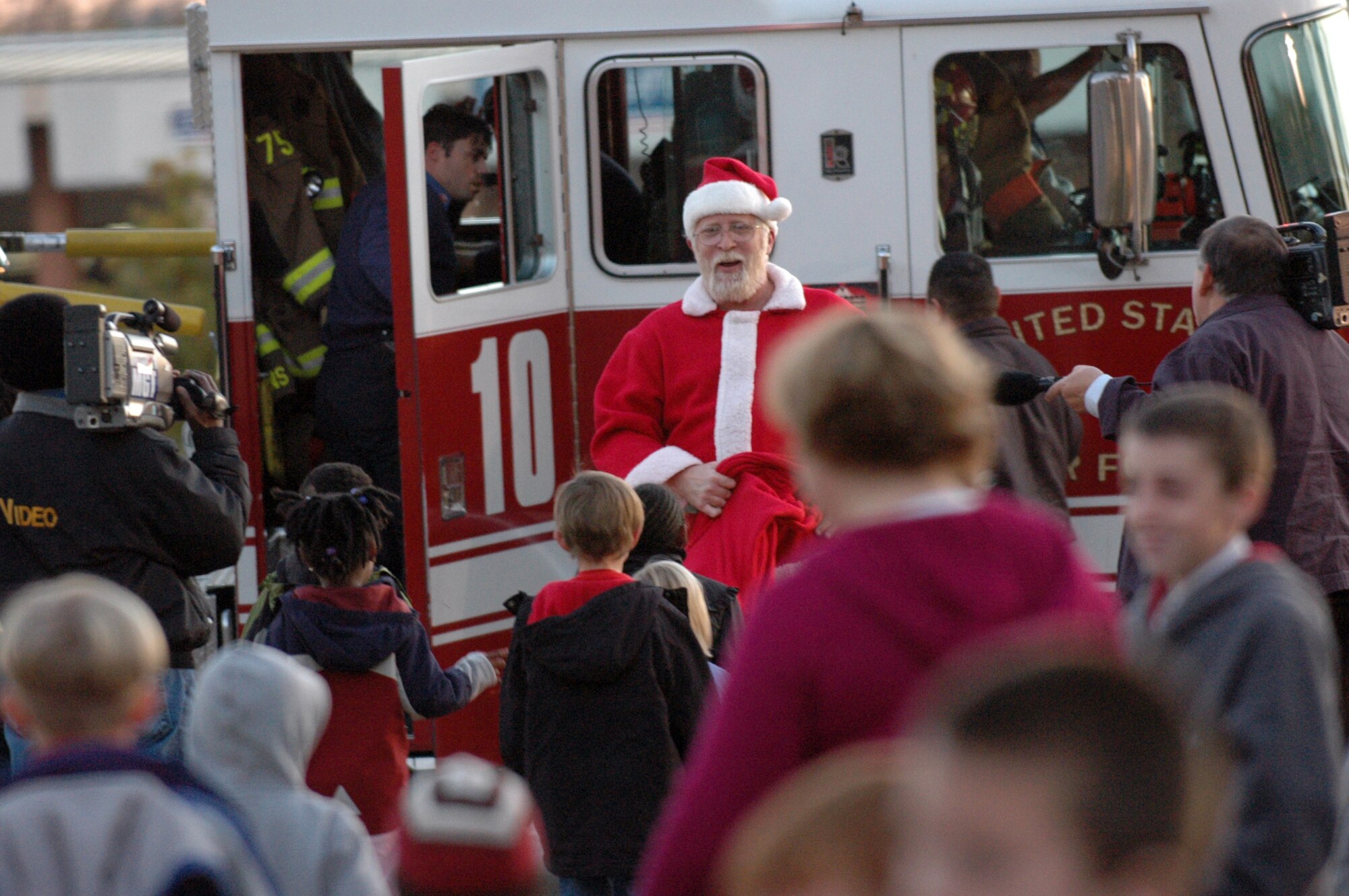 Santa arrived at Robins in a fire truck at the tree lighting ceremony at Robins Chapel Dec. 3. U. S. Air Force photo by Sue Sapp