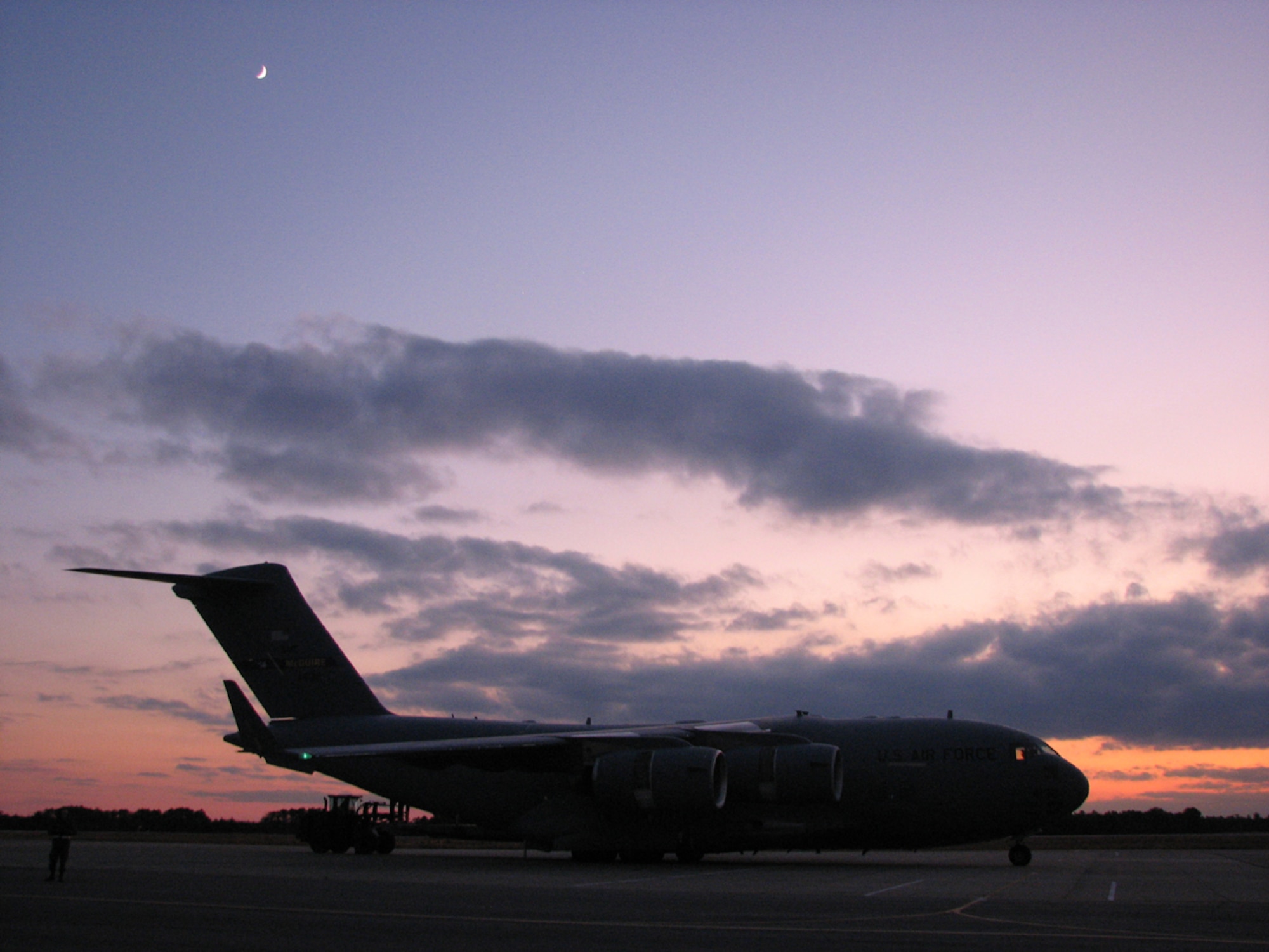 A C-17 Globemaster from McGuire Air Force Base, N.J., is loaded during a Joint Task Force Port Opening exercise held at Lakehurst Naval Air Engineering Station, N.J., Dec. 1-4. The JTF-PO exercise combined Airmen from the 817th Contingency Response Group, McGuire AFB, N.J., and Soldiers from the 689th Transportation Detachment, Ft. Eustis, Va., into a joint-team responsible for establishing and operating a port of debarkation and distribution node. (U.S. Air Force photo/1st Lt. Dustin Doyle)