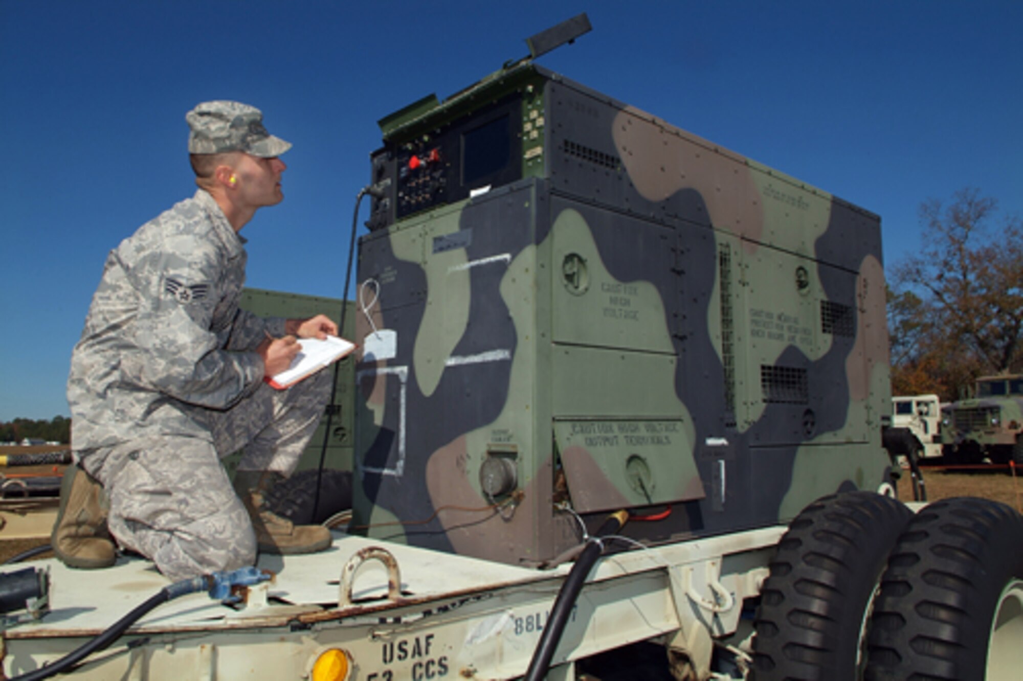 Senior Airman Shaun McVey, 53rd CBCS, performs a two-hour check on a generator used to keep power going during the exercise. U.S. Air Force photo by Tommie Horton