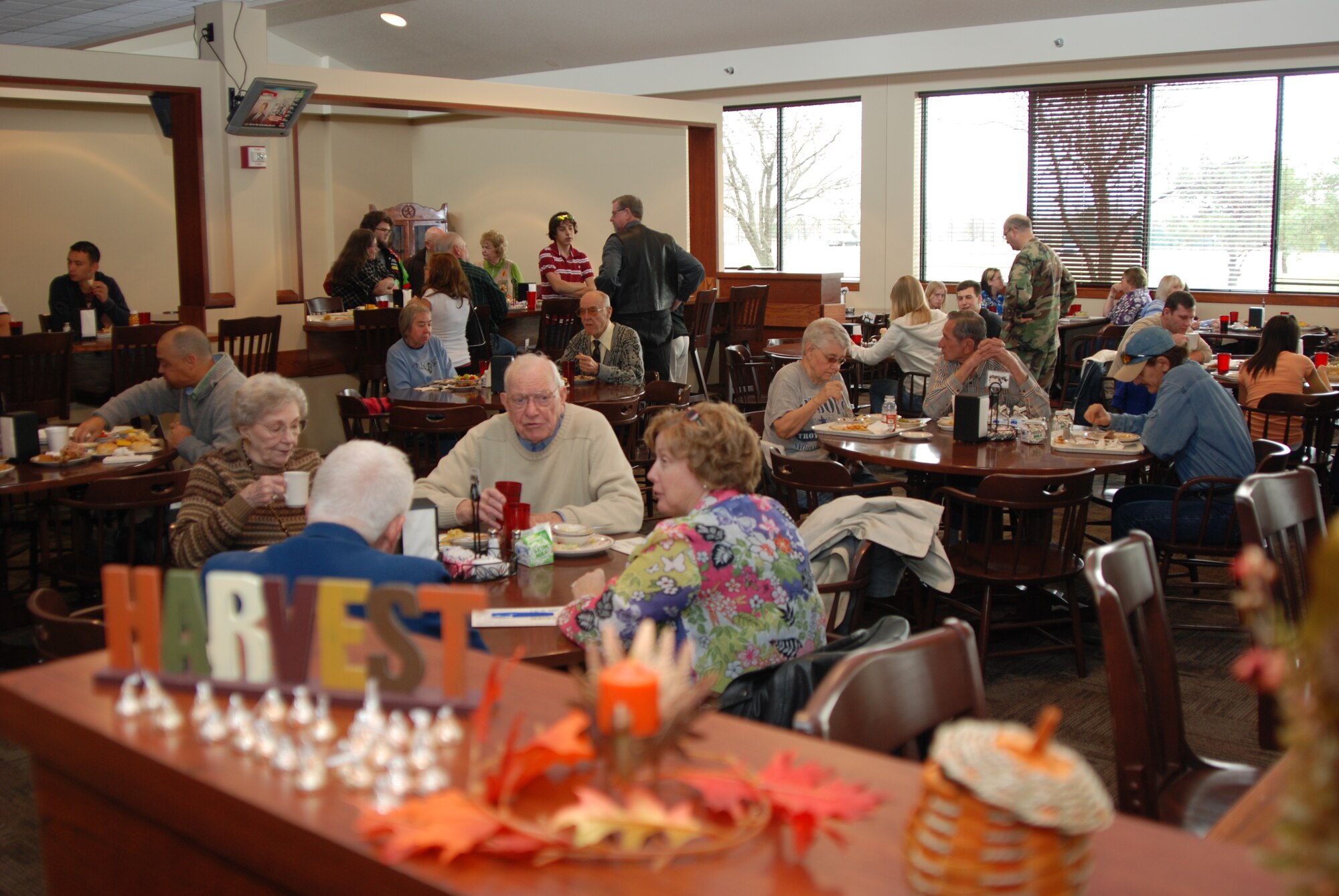 MCCONNELL AIR FORCE BASE, Kan. -- McConnell members gather for a Thanksgiving feast served by wing leadership in the newly remodeled Chisholm Trail dining facility, Nov. 27. (Photo by Airman 1st Class Jessica Lockoski)
