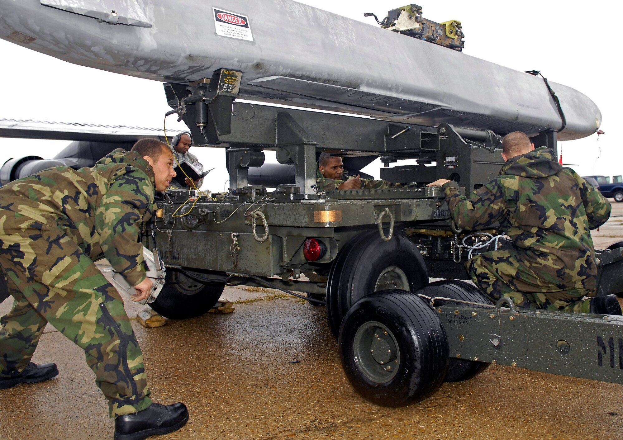 A 2nd Maintenance Squadron weapons load team is evaluated during a portion of the Air Combat Command Nuclear Surety Inspection at Barksdale Air Force Base, La., Nov.12. Base officials welcomed members of the ACC Inspector General team Nov. 9 to focus on three major graded areas throughout the inspection: Nuclear surety program management and administration, the personnel reliability program and logistics movement. (U.S. Air Force photo/Senior Airman Alexandra Sandoval)