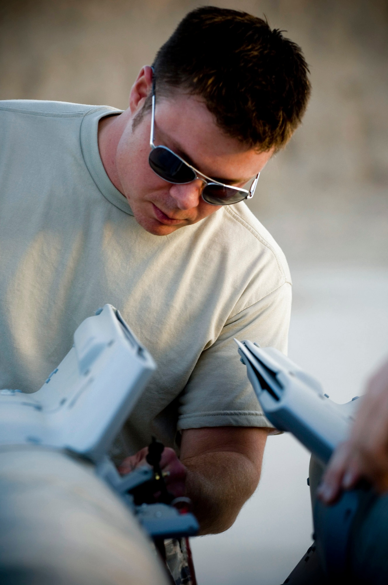 Staff Sgt. Aaron Ciccocioppo inspects a guided bomb unit-12 laser-guided bomb Oct. 27 at Kandahar Airfield, Afghanistan. Sergeant Ciccocioppo is assigned to the 451st Air Expeditionary Group Logistics Flight-Ammo and deployed from Langley Air Force Base, Va. He hails from Lancaster, Pa. (U.S. Air Force photo/Staff Sgt. Samuel Morse) 
