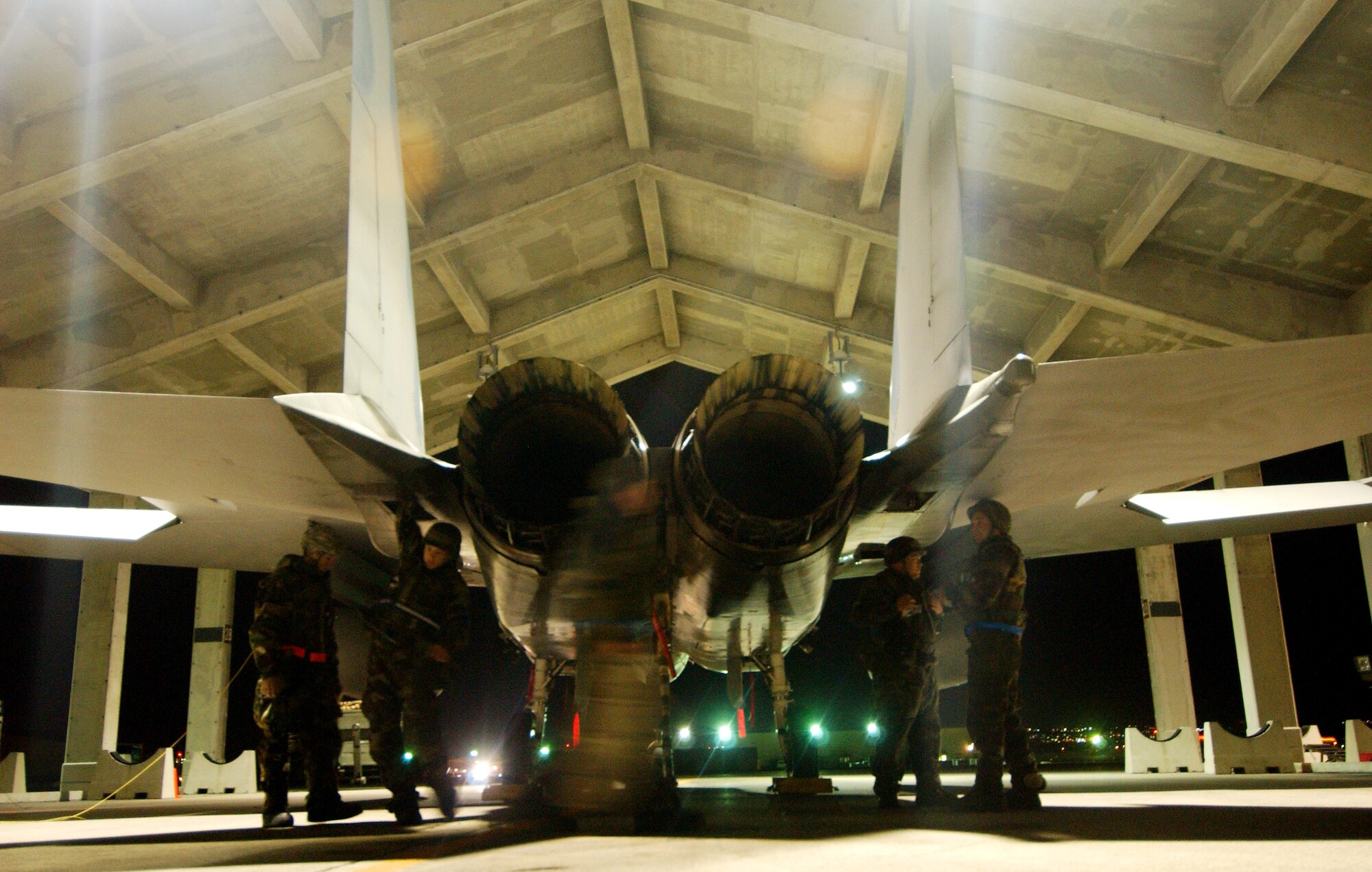 Airmen from the 44th Aircraft Maintenance Unit drop panels from an F-15C Eagle to check the stag actuators for flight control problems Dec. 4, during Local Operational Readiness Exercise Beverly High 09-01 at Kadena Air Base, Japan. The 18th Wing is conducting the exercise to test the readiness of Kadena Airmen.  (U.S. Air Force photo/Tech. Sgt. Rey Ramon)    