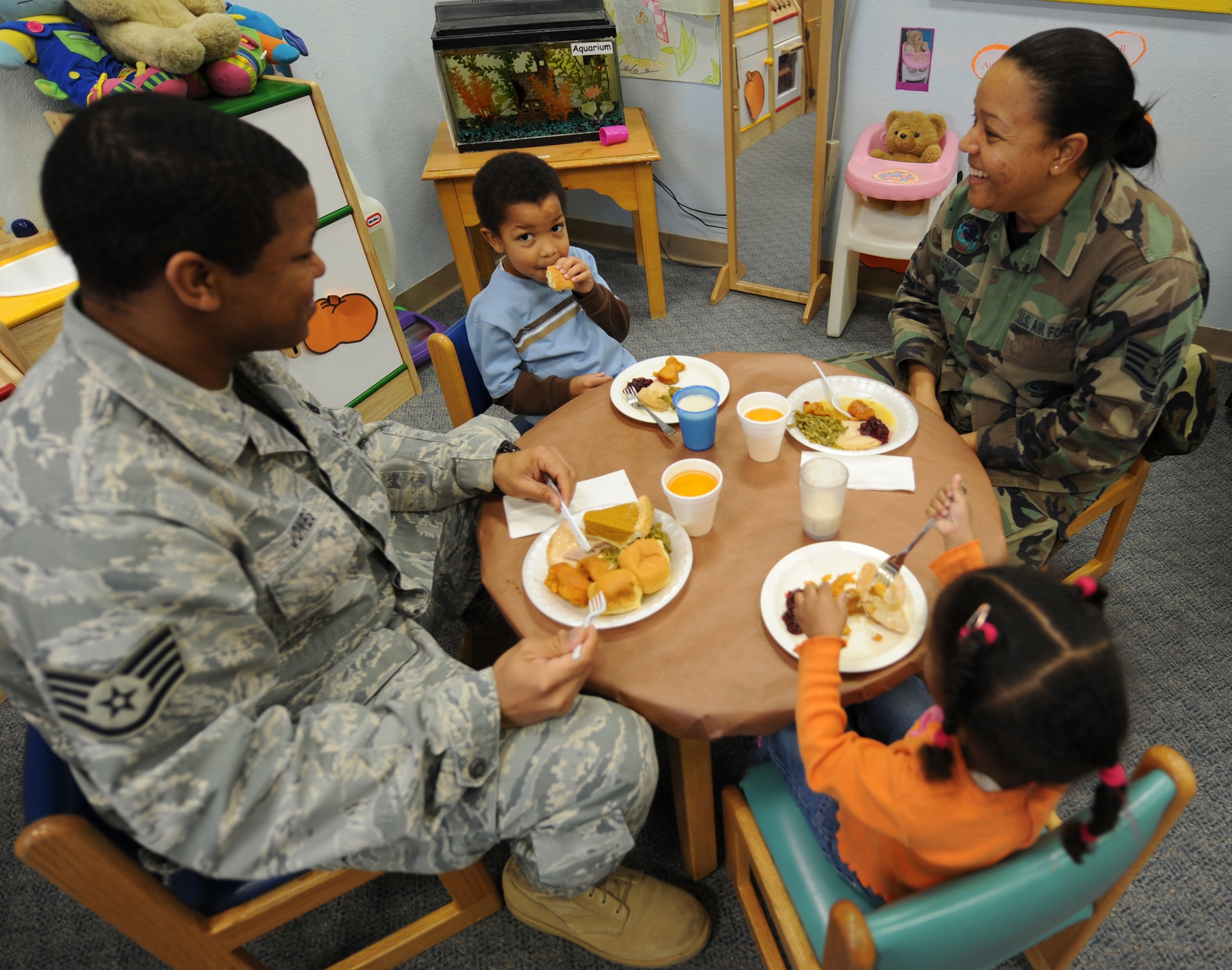 Staff Sgt. Brandon Jones, 49th Materiel Mainenance Group, and Staff Sgt. Nicole Jones, 49th Civil Engineer Squadron, attend the annual Family Feast with their children, Caleb and Rachel, at a Child Develpoment Center at Holloman Air Force Base, N.M., Nov. 24. Parents were invited to come have lunch with their children at the CDC in support of Military family Appreciation Month. (U.S. Air Force photo/Airman 1st Class Michael Means)