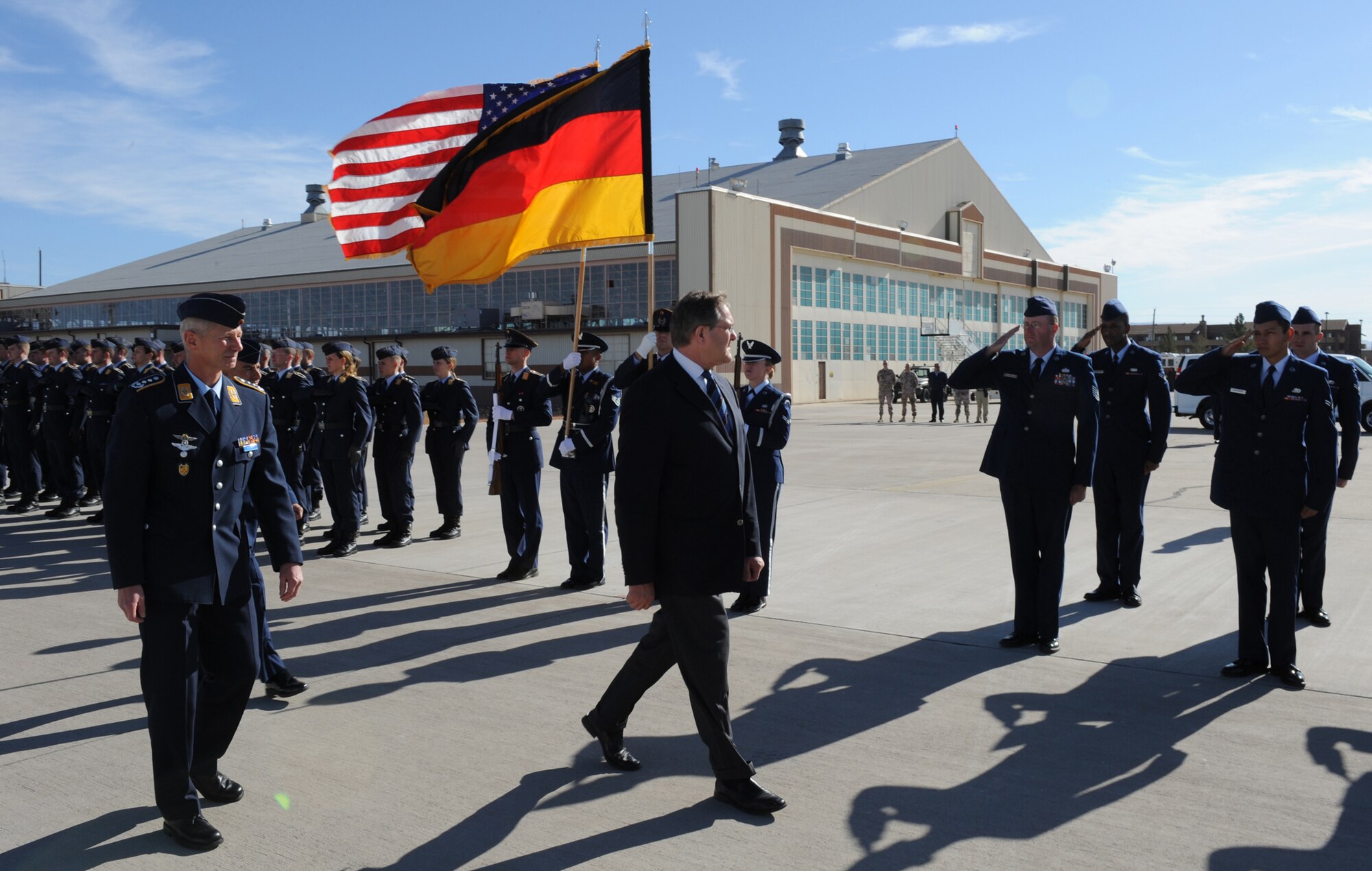 Airmen from the 49th Fighter Wing and the German Air Force Flying Training Center, salute Minister Franz Josef Jung, German Minister of Defense, as he walks past them at Holloman Air Force Base, N.M., Nov. 24. Minister Jung came to visit Holloman to see the German Air Force Flying Training Center. The German air force has been training its aircrews throughout the United States since 1958 before it was moved to Holloman in 1992. (U.S. Air Force photo/Airman 1st Class Michael Means)