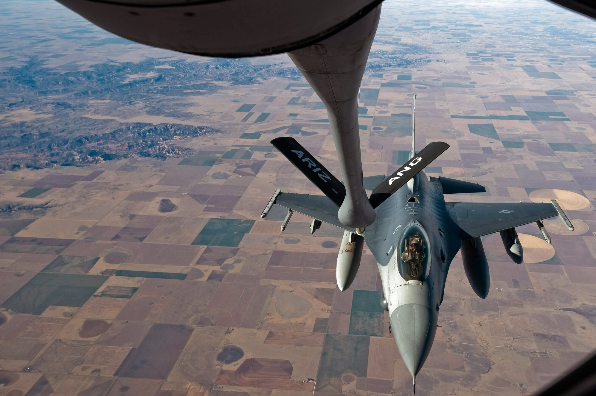 An F-16 Fighting Falcon prepares to get into position to receive fuel from a KC-135 Stratotanker Dec. 1 over the Southwestern United States. The F-16 was en route to Barksdale Air Force Base, La., to take part in Green Flag East, a pre-deployment exercise for Air Combat Command flying units that perform close-air support and precision-guided munitions delivery. The F-16 is from the 120th Fighter Squadron of the Colorado Air National Guard. (U.S. Air Force photo/Master Sgt. John Nimmo Sr.) 